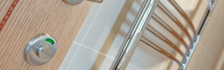 Close up image of the lock on a bathroom door