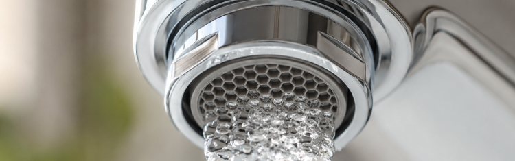 Close up image of a tap aerator