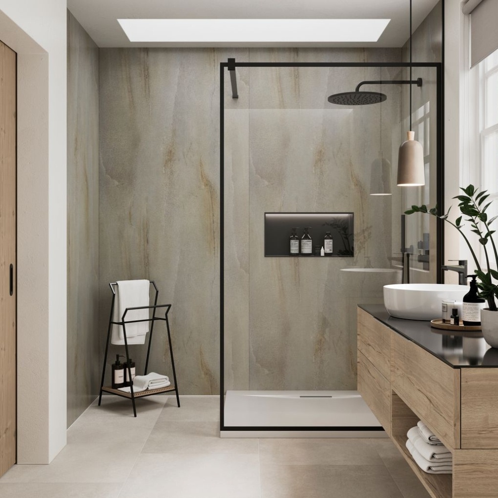 Lifestyle image of the Showerwall Laminate Silverdale Limestone 2440mm x 900mm Square Cut Hydrocore Wall Panel - SW102 installed in a walk in shower enclosure with niche, concealed shower & towel rail