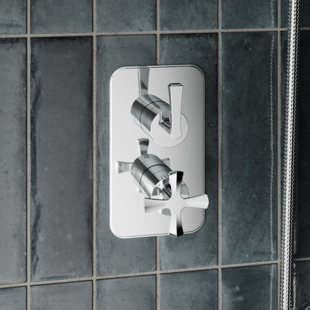 Close-up image of Burlington Riviera Chrome Dual Outlet Shower Valve with Diverter mounted on dark tiles