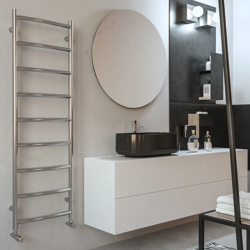 Lifestyle image of the Radox Lacuna 1500mm x 500mm Stainless Steel Heated Towel Rail hung on a bathroom wall next to a white vanity unity & black basin