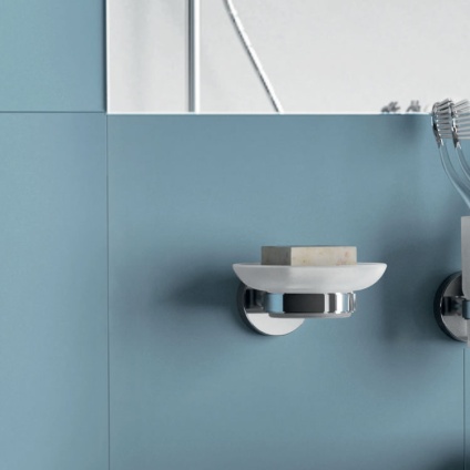 Lifestyle image of Origins Living Gedy G Pro Soap Dish mounted on blue tiled wall.