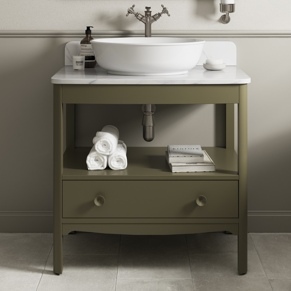 Product lifestyle image of Burlington Guild 850 Carlyle Green Furniture Unit with Carrara Worktop Close up with rolled up towels and book on drawer shelf GU8500DCG_FS GU850TMC