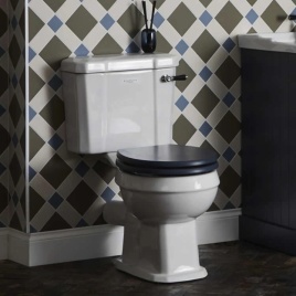 image of a bayswater toilet - close coupled design with black seat in patterned bathroom