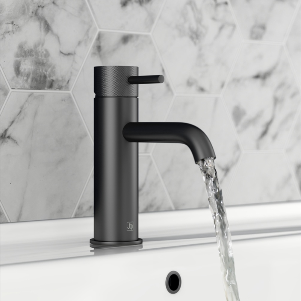 Close up product lifestyle image of the JTP Vos Matt Black Basin Mixer with Designer Knurled Handle