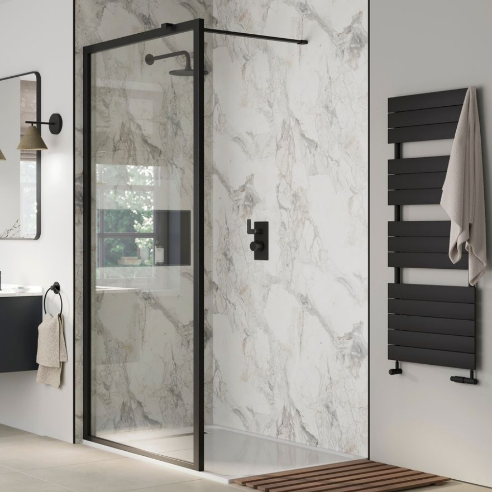 Lifestyle image of the Showerwall Laminate Tempesta 2440mm x 900mm Square Cut Hydrocore Wall Panel - SW103 installed behind a small walk-in shower with black screen, shower niche, and concealed shower system with overhead shower