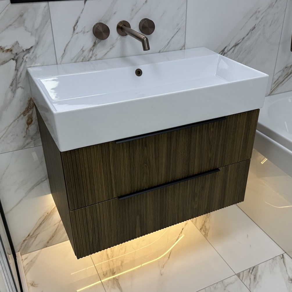 Lifestyle image of Marlow Fluted Bourbon Oak Wall Hung Vanity Unit with Basin from front angle