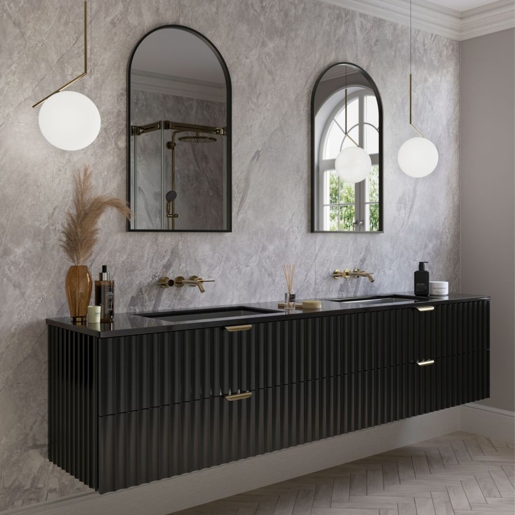 Lifestyle image of the Showerwall Laminate Tacoma Marble 2440mm x 1200mm Square Cut MDF Wall Panel - SW81 installed with a double vanity & unit and basin with arched mirrors