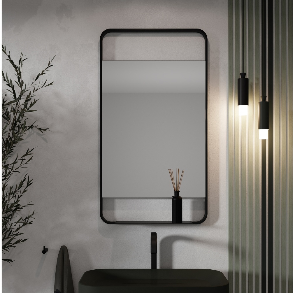 Product Lifestyle image of Origins Living Ludgate 550mm x 1000mm Black Mirror with Shelf mounted on a bathroom wall in front of a basin LDG-002510-BK